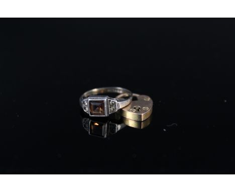 A 9ct gold heart shaped padlock clasp plus a 9ct gold and silver stone set ring