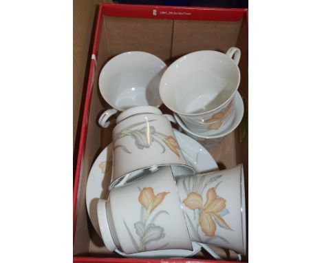 BOX CONTAINING WHITE AND  BROWN FLORAL DECORATED CUPS AND SAUCERS