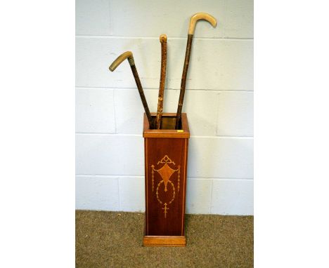 An Edwardian-style inlaid mahogany stick stand, 18cms square x 59cms high; and three vintage walking sticks.
