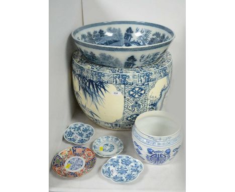 A 20th Century Chinese blue and white planter, decorated with panels of bamboo and stylized foliage within geometric borders,