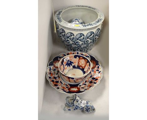 A Chinese blue and white planter, decorated with stylised flowers and foliage, 31cms diameter; together with six various blue