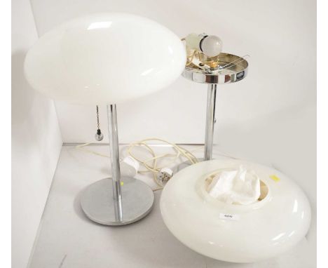 A pair of Art Deco style chromed table lamps, each with an opaque glass circular shade, approximately 29cms diameter, 43cms h