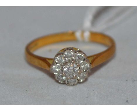 A diamond cluster ring, on 18ct yellow gold shank, ring size K, 2.2g gross.