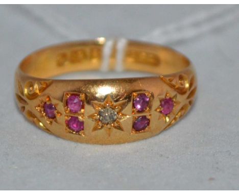 A ruby and diamond ring, in floral pattern mount, on 18ct yellow gold shank, Chester 1903, ring size N, 3.2g gross. 