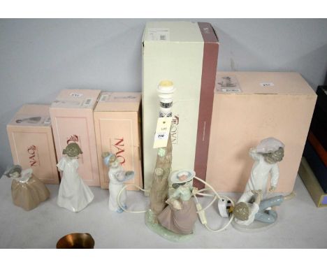 A Nao ceramic 'Out For a Stroll' table lamp, 39cms high, with original box; together with four other Nao figures, each with o