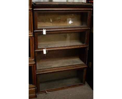 The Globe-Wernicke Co. Ltd., London: an early 20th Century oak four-tier bookcase,  87 x 31 x 139cms high.