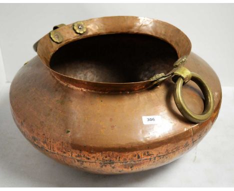 An early 20th Century copper and brass planter, of squat twin-handled form, 46cms diameter.