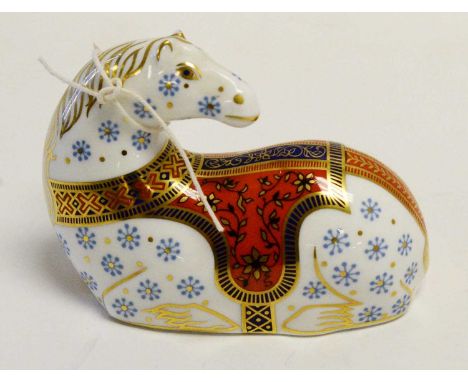 A Royal Crown Derby ceramic horse paperweight, modelled seated, with stopper to underside, 13cms long.