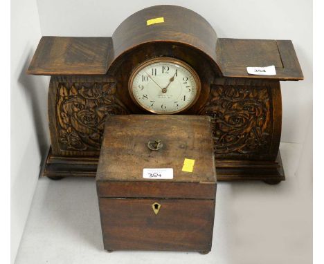 An early 20th Century stained oak mantel clock, retailed by Liberty &amp; Co, Regent St, the case carved with roses, raised o