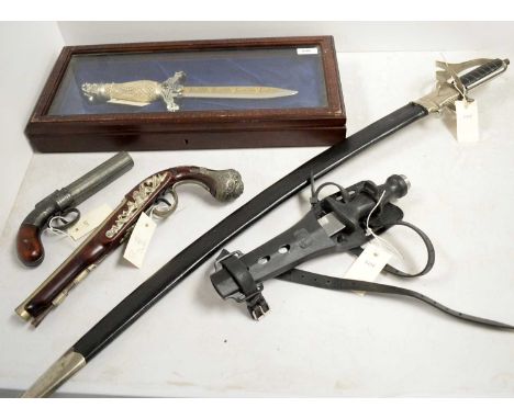 A selection of weaponry, including: Eastern ceremonial dagger, in a mahogany presentation case; reproduction cavalry sword; S