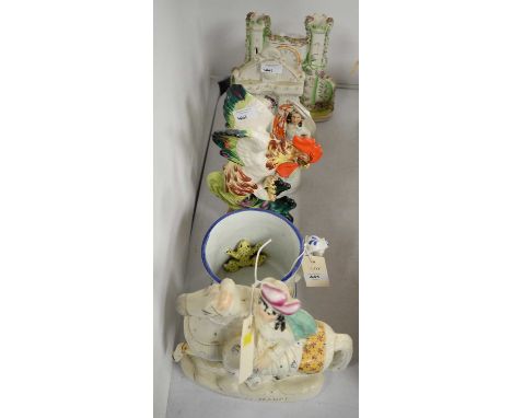 A selection of decorative ceramics, including: Staffordshire frog or surprise mug; Staffordshire Empress of France figure, mo