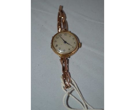 A lady's 9ct gold cased wristwatch, the arabic silvered dial fitted a 15-jewel manual wind movement by Vesta, on flexible str