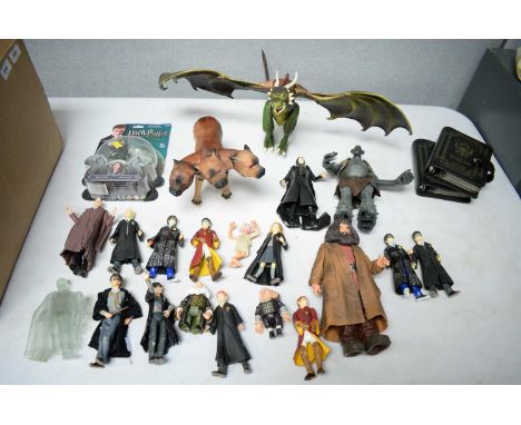 A selection of model figures and collectables relating to J. K. Rowling's Harry Potter series, including: a Harry Potter and 