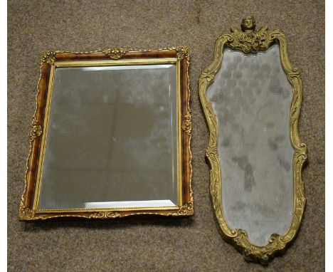 A gold-painted wall mirror by Atsonea, with cherub-head finial and scroll and foliate decoration, 63 x 24cms; and a rectangul