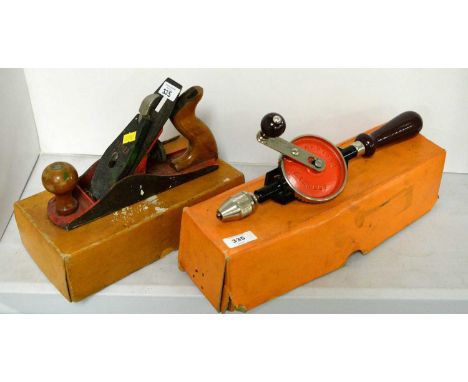 A Stanley Bailey iron-smooth wood plane, in original box; together with another wood plane; a Stanley hand-held drill, model 