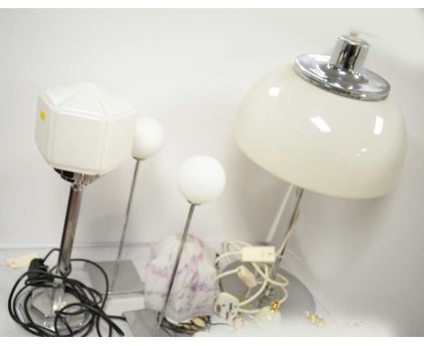 A selection of four chrome table lamps, including: a pair of chrome table lamps with spherical opaque glass shades, 37cms hig