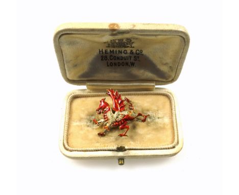 14ct gold and red enamel Royal Welsh Fusiliers brooch, W.2.6cm, 3.8grs, in a Heming &amp; Co., London, case. (2) 