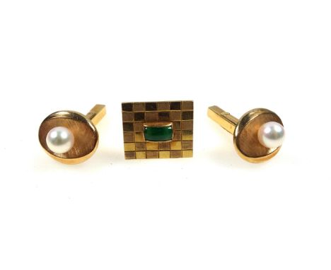 Pair of gentleman's yellow metal oval cufflinks each set with a pearl, stamped K14, and a single cufflink stamped 14k, set gr