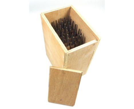 Wooden box containing 40 gold finishing bookbinding hand tools comprising complete alphabet, numbers 0-9, ampersand, AE, 2 po