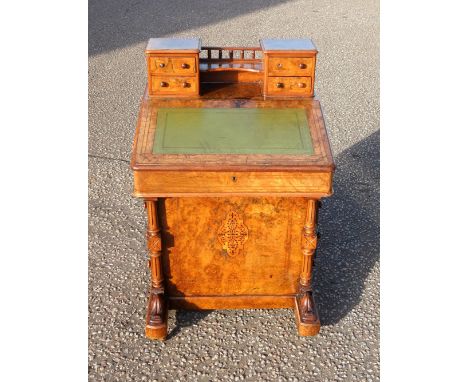 Late Victorian inlaid figured walnut Davenport with a galleried shelf flanked by 4 small drawers, sloping front enclosing 2 d