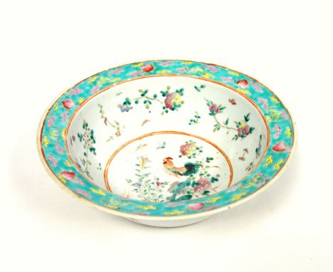 Chinese porcelain Famille Rose circular wash basin, the interior decorated with cockerel, flowers and peaches, within a turqu