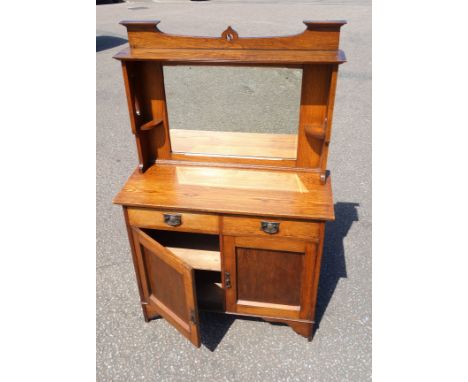 Arts and Crafts oak dresser with a mirror back, two drawers and two panelled doors below, 168.5 x 107 x 45cm overall 