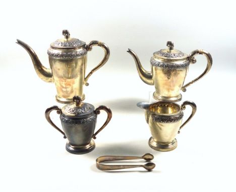 Eastern white metal 4 piece tea and coffee set comprising tea and coffee pot, each with embossed decoration, scroll handle an