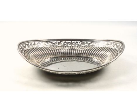 Victorian silver bread basket, of navette form, the reeded body with a floral pierced and bright-cut border, by Henry Wilkins