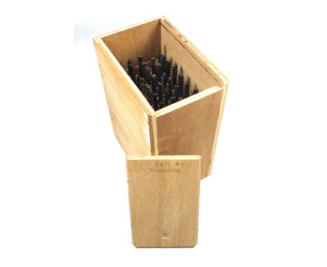 Wooden box containing 39 gold finishing bookbinding hand tools comprising complete alphabet, numbers 1-9, ampersand, AE, dash