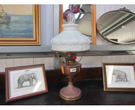 A 1920's oil lamp and shade 