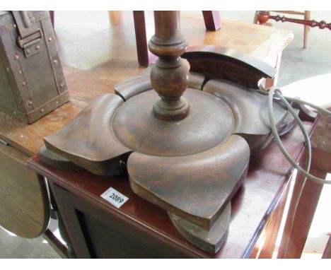 A 1930's beech standard lamp with floral shape base 