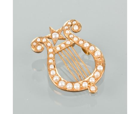 VICTORIAN EIGHTEEN CARAT GOLD PEARL SET HARP BROOCH
set with split pearls, marked 18ct for eighteen carat gold, note: pin mis