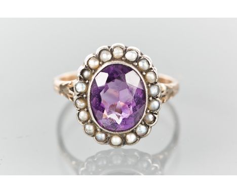 AMETHYST AND SEED PEARL CLUSTER RING
set with a central oval amethyst surrounded by seed pearls, marked 9ct & SIL for nine ca