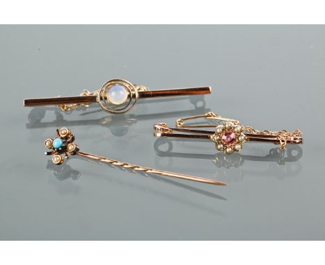 TWO EDWARDIAN BAR BROOCHES
one set with a moonstone, unmarked, the other with pink gems and seed pearls; along with a turquoi