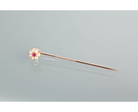 RUBY AND SEED PEARL STAR TIE PIN
set with a central ruby surrounded by seed pearls, unmarked
