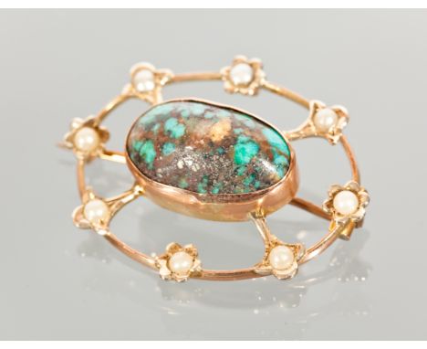 EDWARDIAN TURQUOISE AND PEARL BROOCH set with a large cabochon of veined turquoise 18mm long, within a split pearl set openwo