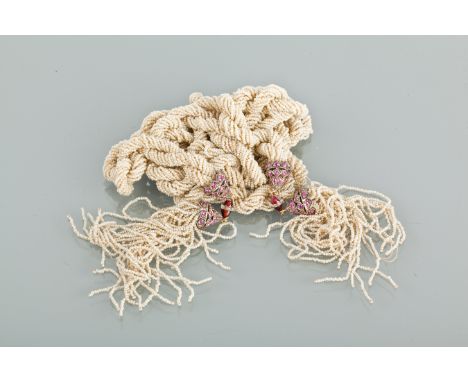 ART DECO SEED PEARL AND RUBY SAUTOIR NECKLACE
formed by twisted strands of seed pearls, with tassel ends, with double ruby se