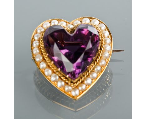VICTORIAN AMETHYST AND SEED PEARL HEART BROOCH
the heart shaped amethyst surrounded by a border of pearls, marked SS18 to the