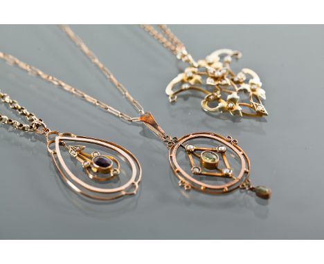 THREE EDWARDIAN PENDANTS
comprising one set with peridots and seed pearls, marked 9ct; one set with seed pearls, also marked 