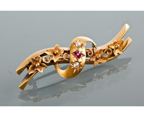 VICTORIAN FIFTEEN CARAT GOLD RUBY AND PEARL SET BROOCH
of curved form and with two parallel bars, with overlaid 's' curve set