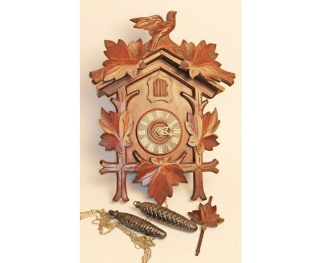 A black forest cuckoo clock, length 46cm.Condition: Minor restoration to inside, sound boxes as pictured, movement appears or