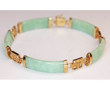 A Chinese gold and jade bracelet, marked 9K', gross weight 12.4g, length 19cm.  