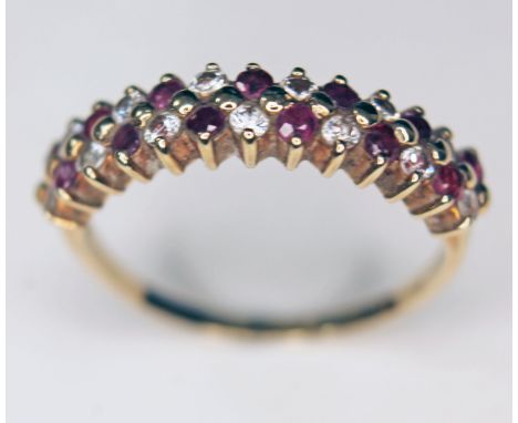 A 9ct gold diamond and ruby coloured stone ring, marked '375', size M, gross weight 2.1g.  