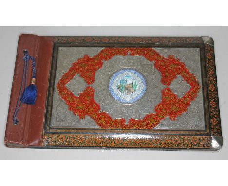 A Persian photography album, white metal overlaid papier-mâché with central enamel panel, 35cm x 21cm.Condition: Very good ov