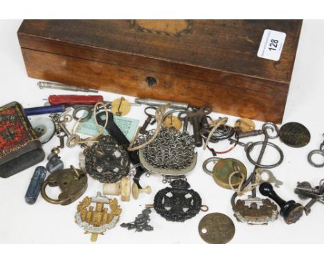 An inlaid box of mixed contents including military badges, old keys, chain mail purse, a 1930s Southern Railway third class r