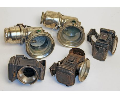 A group of five vintage bicycle lamps.  