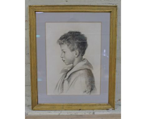 20th century school, side profile portrait of boy, charcoal, 39cm x 53cm, indistinctly signed, glazed and framed 62cm x 76cm.