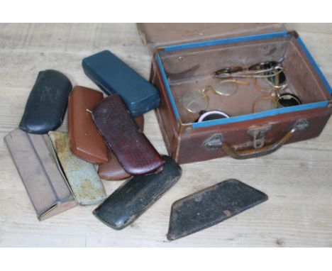 A quantity of vintage spectacles and sunglasses in a small case..  