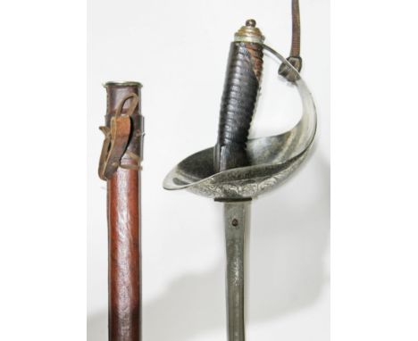 A British WWI 1912 pattern cavalry officers sword, leather grip and scabbard, blade length 88cm.  