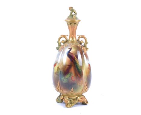 Henry Martin (1887-1917) for Royal Worcester a twin handled ovoid vase with hand painted decoration of a peacock,  signed H W